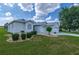 Charming single-story home featuring a well-manicured lawn and an attached two-car garage at 15268 Sw 14Th Avenue Rd, Ocala, FL 34473