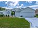 Charming single-story home with a well-manicured lawn, complemented by a two-car garage and a beautifully designed driveway at 15268 Sw 14Th Avenue Rd, Ocala, FL 34473