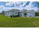 Charming single-story home featuring a well-manicured lawn and an attached two-car garage at 15268 Sw 14Th Avenue Rd, Ocala, FL 34473