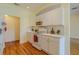 Bright kitchen features white cabinetry, modern appliances, and stylish decor, creating a functional and inviting space at 15268 Sw 14Th Avenue Rd, Ocala, FL 34473