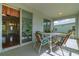 Outdoor patio seating situated by sliding glass doors, offering indoor-outdoor living at 15268 Sw 14Th Avenue Rd, Ocala, FL 34473