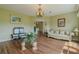 Comfortable living room with backyard view, seamlessly connected to the kitchen and dining areas at 15268 Sw 14Th Avenue Rd, Ocala, FL 34473