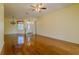 Large living area showcasing hardwood floors, elegant lighting, and a welcoming entrance for a seamless flow at 15268 Sw 14Th Avenue Rd, Ocala, FL 34473