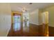 Spacious living room features sleek hardwood floors, leading to a sliding door that opens to the outdoors at 15268 Sw 14Th Avenue Rd, Ocala, FL 34473