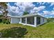 Beautiful home with a spacious lanai and lush green lawn at 15268 Sw 14Th Avenue Rd, Ocala, FL 34473