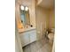 Small bathroom with toilet, sink and vanity at 2733 Scarborough Dr, Kissimmee, FL 34744