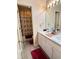 Clean bathroom with double vanity, bathtub, and updated flooring at 2733 Scarborough Dr, Kissimmee, FL 34744