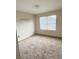 Bright bedroom with neutral walls and carpeted floors at 2733 Scarborough Dr, Kissimmee, FL 34744