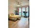 Spacious bedroom with wood-look floors and large windows at 2733 Scarborough Dr, Kissimmee, FL 34744