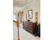 Bright entrance hall with tiled floors and wooden staircase at 2733 Scarborough Dr, Kissimmee, FL 34744