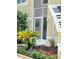 Front entrance with a screened door and landscaping at 2733 Scarborough Dr, Kissimmee, FL 34744