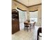 Bright eat-in kitchen with white cabinets and breakfast nook at 2733 Scarborough Dr, Kissimmee, FL 34744