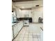 White kitchen with ample counter space and cabinets at 2733 Scarborough Dr, Kissimmee, FL 34744