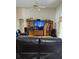 Living room with entertainment center and a comfortable sectional sofa at 2733 Scarborough Dr, Kissimmee, FL 34744