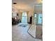 Living room featuring tiled floors and a piano at 2733 Scarborough Dr, Kissimmee, FL 34744