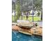 Inviting pool area with a rock waterfall feature and lush landscaping at 2733 Scarborough Dr, Kissimmee, FL 34744
