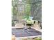 Relaxing poolside seating area with a small table and pillows at 2733 Scarborough Dr, Kissimmee, FL 34744