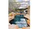 Large, freeform pool with a screened patio and outdoor kitchen at 2733 Scarborough Dr, Kissimmee, FL 34744