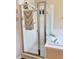 Shower with glass enclosure and tiled walls at 2733 Scarborough Dr, Kissimmee, FL 34744