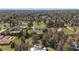 Scenic aerial view of a neighborhood showcasing a house with lush green lawns and mature trees at 4011 Se 47Th Pl, Ocala, FL 34480