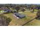 Expansive home situated on a sprawling lot with a long driveway and backyard patio at 4011 Se 47Th Pl, Ocala, FL 34480