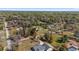 Wide aerial view highlighting the mature trees and well-spaced homes of a quiet residential neighborhood at 4011 Se 47Th Pl, Ocala, FL 34480