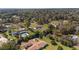 Idyllic neighborhood featuring lush greenery, mature trees, and well-maintained homes from an aerial perspective at 4011 Se 47Th Pl, Ocala, FL 34480