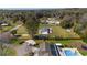Spacious lot with fenced yard, pool and mature trees are showcased in this beautiful neighborhood aerial at 4011 Se 47Th Pl, Ocala, FL 34480