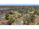 Idyllic neighborhood featuring lush greenery, mature trees, and well-maintained homes in an aerial view at 4011 Se 47Th Pl, Ocala, FL 34480