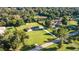 Expansive lot featuring a well-maintained home, lush greenery, and a long private driveway at 4011 Se 47Th Pl, Ocala, FL 34480