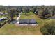 Aerial view captures a home with a spacious fenced yard, perfect for outdoor activities and relaxation at 4011 Se 47Th Pl, Ocala, FL 34480