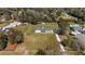 Aerial view showcasing the home's large lot, lush landscaping, and surrounding neighborhood at 4011 Se 47Th Pl, Ocala, FL 34480
