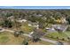 Expansive aerial view showcases a home with a spacious yard, mature trees, and neighborhood setting at 4011 Se 47Th Pl, Ocala, FL 34480
