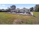 Lovely backyard view, with a patio seating area for outdoor relaxation and activities at 4011 Se 47Th Pl, Ocala, FL 34480