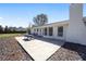 Outdoor patio featuring a picnic table, seating, and a view of the expansive backyard and natural surroundings at 4011 Se 47Th Pl, Ocala, FL 34480