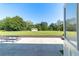 Enjoy the view of the spacious backyard from the covered porch at 4011 Se 47Th Pl, Ocala, FL 34480