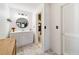 Bright bathroom featuring a single vanity, modern fixtures, and a doorway to a separate toilet room at 4011 Se 47Th Pl, Ocala, FL 34480