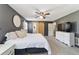Large bedroom with white carpet, grey walls, and a stylish barn door at 4011 Se 47Th Pl, Ocala, FL 34480