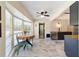 Bright breakfast nook featuring a bay window, neutral paint, and a ceiling fan at 4011 Se 47Th Pl, Ocala, FL 34480