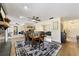 Open dining room flows into living area, showcasing a spacious and connected floor plan at 4011 Se 47Th Pl, Ocala, FL 34480