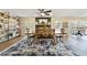 Inviting dining room with rustic table, chairs, and a black and white patterned rug at 4011 Se 47Th Pl, Ocala, FL 34480