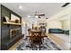 Open dining area with fireplace, wood table, and a seamless transition to the living room at 4011 Se 47Th Pl, Ocala, FL 34480