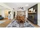 Bright dining room with wood table, fireplace, and built-in bookshelves at 4011 Se 47Th Pl, Ocala, FL 34480