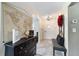 Charming foyer featuring tile flooring, a decorative wreath, and a console table with decor at 4011 Se 47Th Pl, Ocala, FL 34480
