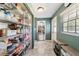 Bright hallway with ample pantry storage and a view into the living area at 4011 Se 47Th Pl, Ocala, FL 34480