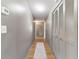 Well-lit hallway with hardwood floors and closet for storage space at 4011 Se 47Th Pl, Ocala, FL 34480
