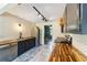 Well-lit kitchen featuring butcher block countertops, tiled backsplash, and stainless steel appliances at 4011 Se 47Th Pl, Ocala, FL 34480