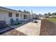 Concrete patio with chairs and a play set, providing a comfortable and enjoyable outdoor living space at 4011 Se 47Th Pl, Ocala, FL 34480