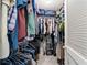 Walk-in closet providing ample storage with hanging rods, shelves, and an organized layout at 4011 Se 47Th Pl, Ocala, FL 34480