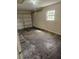 Attached garage space with a garage door and window at 4 Spring Trl, Ocala, FL 34472